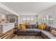 Open-concept living space with kitchen, dining area and comfortable gray sofa at 3224 Star Gazing Ln, Durham, NC 27703