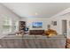 Inviting living room with a cozy sectional sofa and a large television at 3224 Star Gazing Ln, Durham, NC 27703