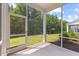 A view from the screened porch to the lush, green lawn and privacy provided by the mature trees at 3224 Star Gazing Ln, Durham, NC 27703