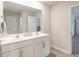 Bathroom features double sink vanity, large mirror, and neutral colors at 3292 Longpine Rd, Burlington, NC 27215