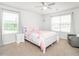 Bedroom featuring neutral paint, two windows, and a ceiling fan at 3292 Longpine Rd, Burlington, NC 27215