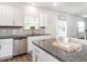 Bright kitchen features granite countertops and stainless steel appliances at 3292 Longpine Rd, Burlington, NC 27215
