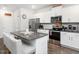 Kitchen features stainless steel appliances and granite countertops with seating at 3292 Longpine Rd, Burlington, NC 27215