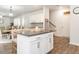 Kitchen island features white cabinetry and seating space at 3292 Longpine Rd, Burlington, NC 27215