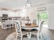 Bright, open kitchen and dining area with access to a deck or patio at 3292 Longpine Rd, Burlington, NC 27215