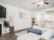Spacious living room with fireplace, neutral walls, wood floors, and ample seating at 3292 Longpine Rd, Burlington, NC 27215
