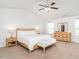Spacious primary bedroom features a ceiling fan, sitting area, and natural light at 3292 Longpine Rd, Burlington, NC 27215