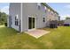 Patio with sliding glass doors leading to green backyard, connecting indoor and outdoor living at 3417 Cardinal Lake Dr, Durham, NC 27704