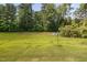 Expansive backyard with a dish satellite, perfect for outdoor activities and relaxation at 3417 Cardinal Lake Dr, Durham, NC 27704