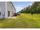 Expansive backyard with lush green grass and a patio, perfect for outdoor activities at 3417 Cardinal Lake Dr, Durham, NC 27704