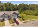 Townhome featuring a mulit-toned exterior and a two car garage, with ample parking at 3417 Cardinal Lake Dr, Durham, NC 27704