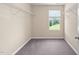 Empty walk-in closet providing ample storage space with wire shelving and a window view at 3417 Cardinal Lake Dr, Durham, NC 27704
