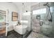 Bathroom featuring a modern soaking tub, a glass-enclosed shower, and stylish tile work at 3748 Westbury Lake Dr, Raleigh, NC 27603