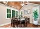 Dining room with hardwood floors, a fireplace, and natural light at 3748 Westbury Lake Dr, Raleigh, NC 27603