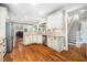 Bright kitchen features granite countertops, stainless steel appliances and hardwood floors at 3748 Westbury Lake Dr, Raleigh, NC 27603