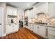 Bright kitchen features stainless steel appliances, granite counters, and a wine rack at 3748 Westbury Lake Dr, Raleigh, NC 27603