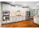 Bright kitchen with stainless steel appliances, granite countertops and hardwood floors at 3748 Westbury Lake Dr, Raleigh, NC 27603
