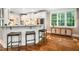 Kitchen island with barstool seating and stainless steel appliances at 3748 Westbury Lake Dr, Raleigh, NC 27603