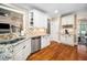 Kitchen features granite countertops, stainless steel appliances, and hardwood floors at 3748 Westbury Lake Dr, Raleigh, NC 27603