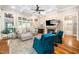 Bright living room with a fireplace, hardwood floors, and coffered ceilings at 3748 Westbury Lake Dr, Raleigh, NC 27603