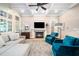 Bright living room with a fireplace, hardwood floors, and coffered ceilings at 3748 Westbury Lake Dr, Raleigh, NC 27603