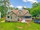 Well-maintained home backyard with green grass and trampoline at 39 Westover Ct, Sanford, NC 27332