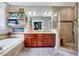 Bathroom features tile shower, soaking tub, and double vanity sink at 39 Westover Ct, Sanford, NC 27332