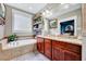 Bathroom with soaking tub, window and double vanity sink at 39 Westover Ct, Sanford, NC 27332