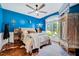 Stylish bedroom with hardwood floors, a large window, and unique decorative touches at 39 Westover Ct, Sanford, NC 27332