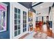 Open entryway featuring hardwood floors and a decorative glass paneled door leading into the living room at 39 Westover Ct, Sanford, NC 27332