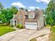 Charming home with stone accents, well maintained lawn, attached two-car garage and mature trees at 39 Westover Ct, Sanford, NC 27332