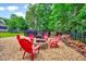 Cozy backyard firepit with chairs, ideal for outdoor gatherings at 39 Westover Ct, Sanford, NC 27332