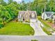 Beautifully landscaped home exterior with a long driveway at 39 Westover Ct, Sanford, NC 27332