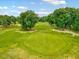Expansive green golf course with mature trees, ideal for outdoor recreation and leisure at 39 Westover Ct, Sanford, NC 27332