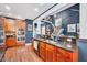 Gourmet kitchen with granite countertops, stainless appliances, and adjacent staircase at 39 Westover Ct, Sanford, NC 27332