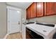 Functional laundry room featuring a washer, dryer, and cabinet storage at 39 Westover Ct, Sanford, NC 27332