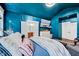 Primary bedroom features eye-catching blue walls and a tv at 39 Westover Ct, Sanford, NC 27332