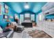 Comfortable bedroom featuring blue walls, vaulted ceilings, and natural light at 39 Westover Ct, Sanford, NC 27332