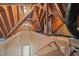 Exposed wooden beams in unfinished attic space, showing insulation and mechanical elements, revealing construction and potential at 402 Bridewell Ct, Cary, NC 27518
