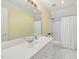 Well-lit bathroom featuring a single vanity, tile flooring, and shower at 402 Bridewell Ct, Cary, NC 27518