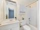 Bright bathroom featuring white tile, vanity, and a combined shower-tub at 402 Bridewell Ct, Cary, NC 27518