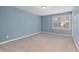 Bedroom with plush carpet and a window bringing in natural light at 402 Bridewell Ct, Cary, NC 27518