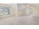 Bright bonus room with natural light from multiple windows and a ceiling fan at 402 Bridewell Ct, Cary, NC 27518