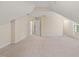 Large bonus room with multiple entry points and windows providing natural light at 402 Bridewell Ct, Cary, NC 27518