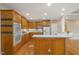 Spacious kitchen features stainless steel appliances, hardwood floors and breakfast bar at 402 Bridewell Ct, Cary, NC 27518