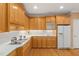 Beautiful kitchen with wooden cabinets, stainless appliances and ample counter space at 402 Bridewell Ct, Cary, NC 27518