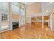 Expansive living room with fireplace, high ceilings, and open access to kitchen and dining areas at 402 Bridewell Ct, Cary, NC 27518