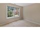 Bedroom with carpet, neutral wall color, double hung windows, and a backyard view at 404 Ascott Way, Durham, NC 27713