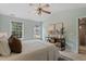 Bright bedroom featuring a console table and large windows at 404 Ascott Way, Durham, NC 27713