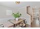 Dining room featuring a modern table, stylish decor, decorative accents, view of stairs and accent wall trim at 404 Ascott Way, Durham, NC 27713